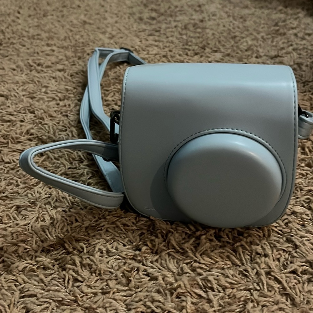 Fuji camera with extra lens and a carrying case